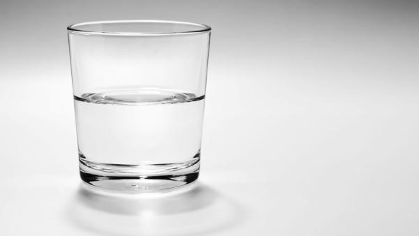 a glass half full, or empty, with water