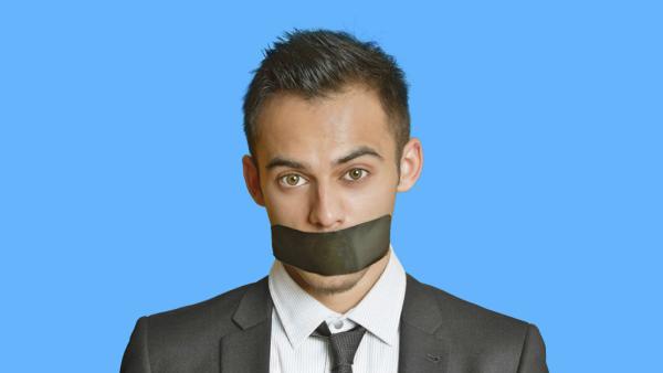 man with tape over his mouth
